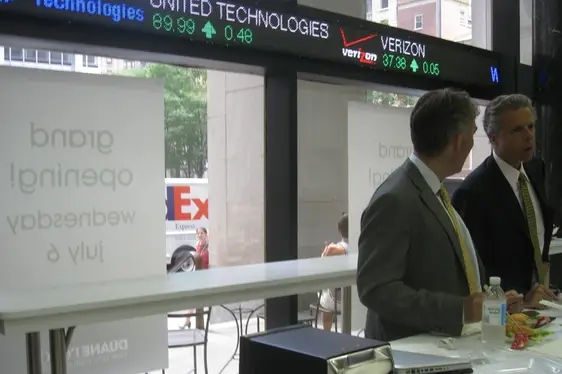 Stock ticker, suits, and sushiâa perfect trio.